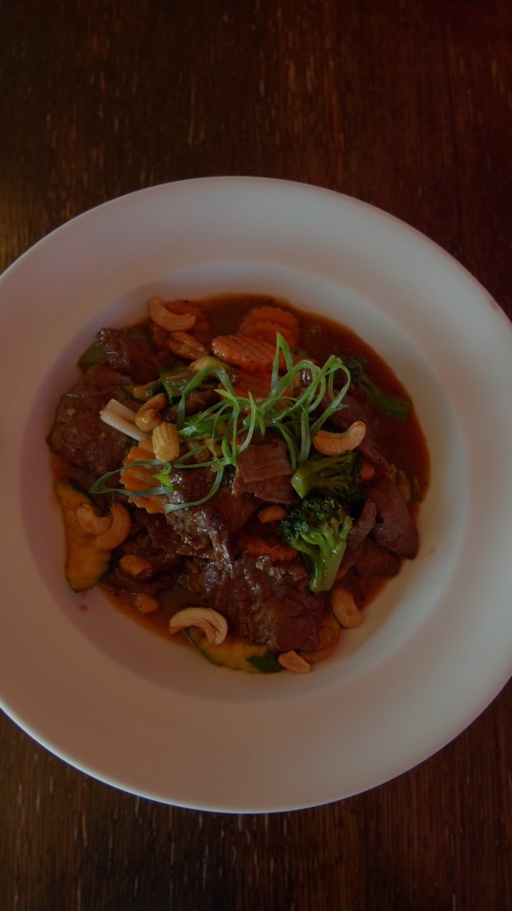 A plated Thai beef dish with cashews at La Ruby Thai